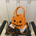 Vibrant orange pumpkin-shaped crossbody bag with Jack-o'-lantern face and spider web patterns - Orange