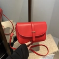 Vintage red leather saddle bag with gold metal buckle and adjustable shoulder strap - Red