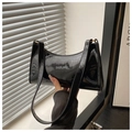 Close-up of black patent leather baguette bag with high-gloss finish and light shadows - 24.5*6.5*15.5cm / Glossy Black