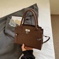 Modern dark brown pebble leather tote bag with silver lock and detachable shoulder strap - Coffee