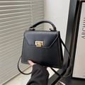 Bolso estilo Kelly clásico en cuero negro con cierre dorado y asa superior de moda actual - Negro