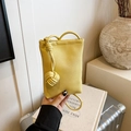 Minimalist mini phone bag in lemon yellow pebbled leather with knotted shoulder strap - Yellow