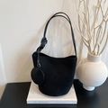 Minimalist black matte suede bucket bag with round coin purse charm on the shoulder strap - Black