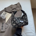 Retro black crossbody bag with white floral embroidery and elegant leather handle - Black