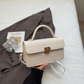 Borsa a tracolla bianco crema con trama a coccodrillo e chiusura a scatto dorata - Bianco Sporco