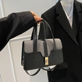Elegante schwarz-graue gewebte Handtasche mit Goldverschluss für den Büroalltag - Schwarz