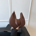 Brown faux leather crescent bag with pebbled texture and gold-tone metal hardware - Brown