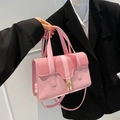 Rosafarbene Handtasche aus Leder mit gewebtem Überschlag und goldenem Drehverschluss - Rosa