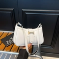 Chic white leather underarm bag with gold metallic buckle and sleek minimalist profile - White