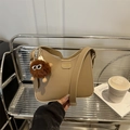 Minimalist beige crossbody bag with adjustable strap and cute plush charm detail - Pom-pom Ornament / Khaki