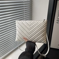 Minimalist white V-quilted crossbody bag featuring black stud accents and slim strap - White