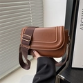 Brown faux leather saddle bag with wide fabric strap and gold hardware accents - Brown