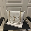 White textured faux leather tote bag with gold chain straps and deer charm - White