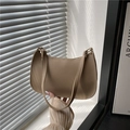Minimalist beige leather underarm bag for women with slim strap and top zipper design - Khaki