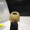 Golden quilted mini handbag with metal finish and silver chain strap for women - Gold
