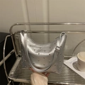 Silver metallic bucket bag with studs, Y2K style crescent shape and adjustable strap - Silver