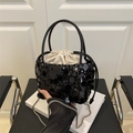Bolso saco minimalista de lentejuelas negras con forro interior de cordón crema - Negro