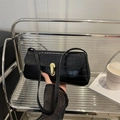 Classic black crocodile pattern baguette bag with a stylish golden oval metal clasp lock - Black