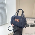 Navy blue denim crossbody bag with contrast stitching and leather trim details - Blue