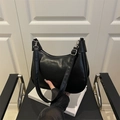 Minimalist black crescent shoulder bag with silver buckle and adjustable strap - Black