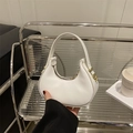 Minimalist white half-moon handbag in matte faux leather with golden zipper details - White