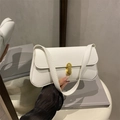 White baguette underarm bag in lychee pattern leather with a gold capsule swivel lock - White
