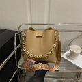 Khaki bucket bag with lychee texture featuring a resin chain and patterned strap - Khaki