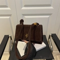 Deep brown suede crossbody bag with thick rope strap and gold twist lock closure - Brown
