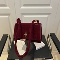 Burgundy suede shoulder bag with gold twist lock and knotted strap design - Red