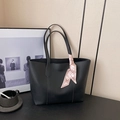 Minimalist black leather tote bag with elegant pink H-pattern silk scarf on handle - Black