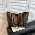 Brown tote bag with bear monogram pattern on leather surface and long shoulder straps - Brown