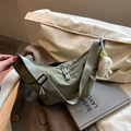 Chic bean green dumpling crossbody bag with a white plush charm and wide strap - With Pendant / Green