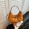 Brown suede crescent bag with leather bow detail and heart pendant, cross-body style - Brown