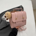 Pink matte suede mini backpack featuring gold round buckles and a plush bear pendant - With Pendant / Pink
