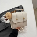 Minimalist cream white leather backpack with gold buckle detail and plush charm - With Pendant / White