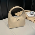 Minimalist beige semi-circle leather handbag with top handle and dual zippers - Khaki