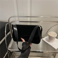 Minimalist black matte underarm bag with flap design and smooth leather shoulder strap - Black
