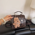 Brown litchi leather backpack with cartoon print and plush dog charm accessory - With Pendant / Brown