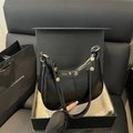 Minimalist black shiny leather dumpling bag with gold studs and metal ring strap - Black