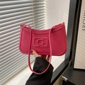 Sac à bandoulière rose fuchsia style français avec logo G embossé et fines anses - Rose