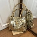 Chic tote bag featuring shiny gold sequins and woven handles with a fashion label - Gold