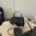 Minimalist black patent leather square bag with silver hardware and curved bottom - Black