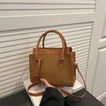 Brown patchwork crossbody bag featuring smooth and suede textures with top handles - Tan