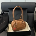Brown textured leather shoulder bag with red heart charm in a premium black gift box - Brown
