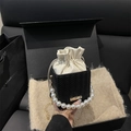 Woven texture mini bucket bag with large pearl handle and drawstring interior - Black