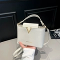 Chic milky white gloss leather crossbody bag with iconic gold V-buckle and hand strap - White