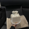 Mini cream woven bucket bag with pearl handle and golden chain shoulder strap - Beige