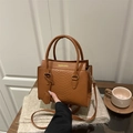 Brown faux crocodile leather crossbody bag with top handles and fashion text detail - Tan