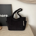 Minimalist black corduroy tote bag with side pockets and stylish white rope detail - Black
