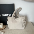 Minimalist beige corduroy tote bag with large capacity and side pockets for daily commute - Off White